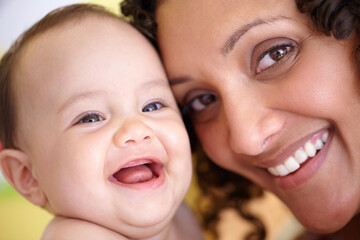 Mother, baby and closeup portrait of happy faces of Arabic family or picture of mom, laughing kid and fun memory together. Face, healthy child and mommy smile of happiness in home, house or bedroom