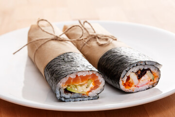 Sushi burrito - new trendy food concept - obrazy, fototapety, plakaty