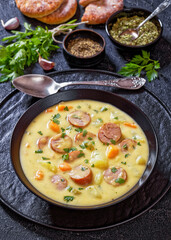 German potato soup with sausages in bowl