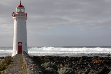 Fototapeta na wymiar Port Fairy lighthouse (built 1859) on Griffiths Island, Victoria, Australia. 