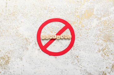 Word CENSORED with prohibition sign on grunge background