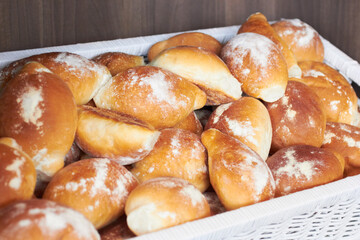 Flour bread, food and bakery basket of rolls from cooking, catering service, breakfast or baking meal at cafe. Bunch of fresh baked or crispy roll snack for eating, nutrition or fiber in restaurant