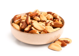 Fototapeta na wymiar Bowl of delicious Brazil nuts isolated on white background