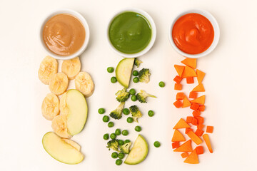 Composition with bowls of healthy baby puree and ingredients on white background