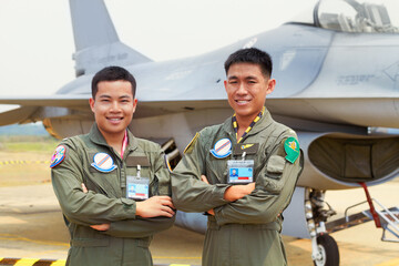 Portrait of men, fighter pilot team in military with jet and smile at airforce base with arms crossed in Korea. Freedom, transport and proud Asian soldier with airplane, confident and service in army