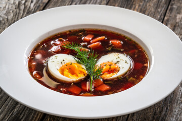 Red borsch - beetroots soup on wooden table