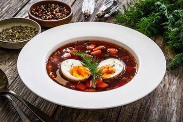 Red borsch - beetroots soup on wooden table