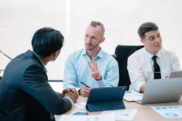 Group of diverse business people discussing a project in a meeting for analysis graph company financial.