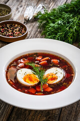 Red borsch - beetroots soup on wooden table