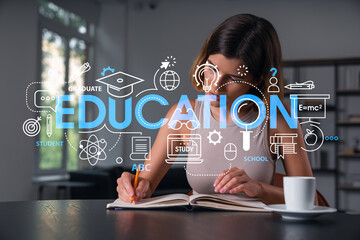 Smiling woman in casual wear taking notes in notebook at office workplace with coffee cup. Concept of distant business education, information technology, dreaming, thinking. Math drawings