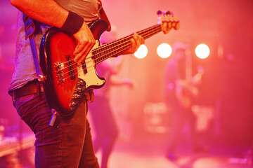Bass player in a concert.