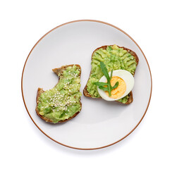 Plate of tasty avocado toasts with egg on white background