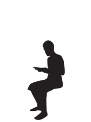 a man sitting and reading a book