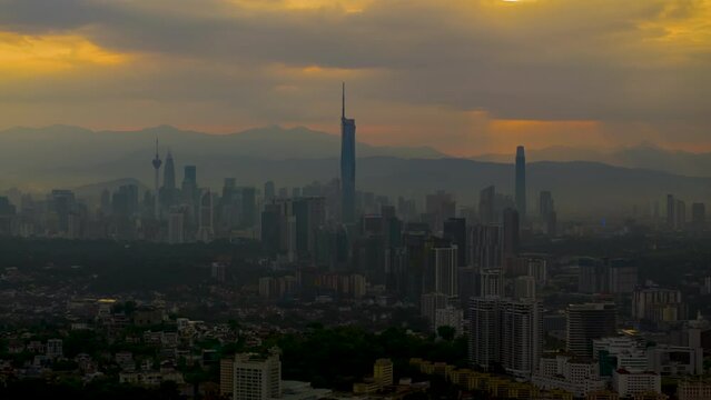 Aerial Hyperlapse of Kuala lumpur cityscape view  overlooking at tallest sky scrapper in KL during sunrise