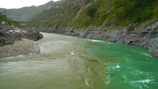 Curvy road at Devprayag, Godly Confluence. Here Alaknanda meets the Bhagirathi river and both rivers thereafter flow on as the Holy Ganges river or Ganga. Garhwal, Uttarakhand, India