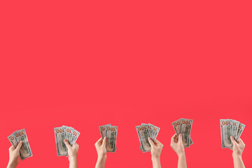 Women with dollar banknotes on red background