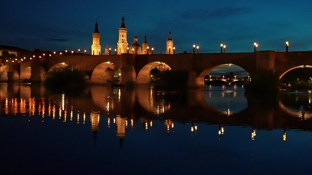 View on the cathedral of Our Lady of the Pilar with the Stone bridge over Ebro river at night. Zaragoza, Spain