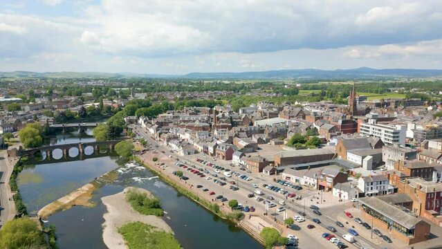This aerial drone video shows the town of Dumfries in Dumfries and Galloway, south Scotland. The river Nith flows through the town center. 