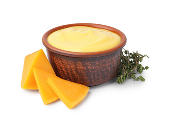 Bowl with tasty cheddar sauce, chunks of cheese and rosemary on white background