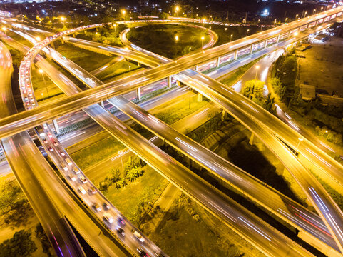Aerial circular intersection transport city road at night with light © themorningglory