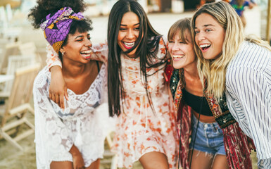 Multiracial happy friends having fun outdoor at beach party - Soft focus on right girl face
