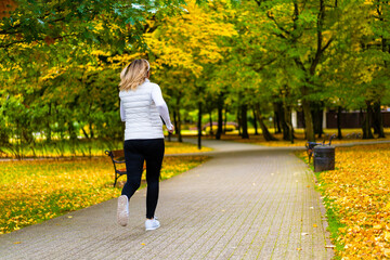 Fototapeta premium Healthy lifestyle - woman running in city park 