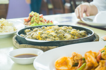 Fish with seafood spicy asian curry serve on table