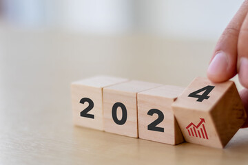 Business growth concept in 2024. Business goals and achievement. Sustainable development. Wooden...