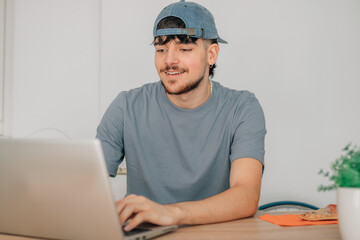 young man at desk with computer