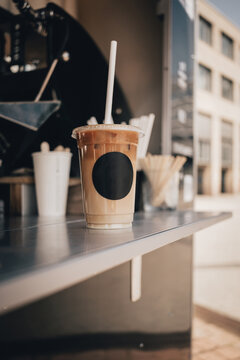 Fresh Cup Of Iced Coffee On Food Truck Counter Top. Blank Labeled Cup.