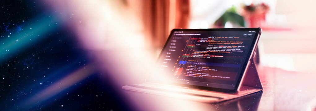 Notebook closeup photo. CSS, JavaScript and HTML usage. Monitor closeup of function source code. Abstract IT technology background. Software source code.