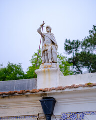 Obraz premium Porto, Portugal - 2023. Little statue on a roof.