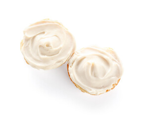 Tasty croutons with cream cheese on white background