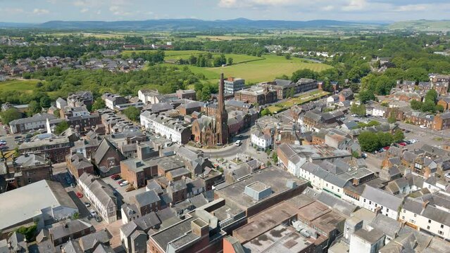 This aerial drone video shows the town of Dumfries in Dumfries and Galloway, south Scotland. You can see a beautiful old church in this town. 