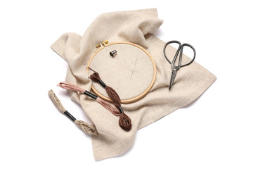 Embroidery hoop with canvas, scissors and mouline threads isolated on white background