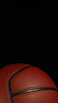 vertical video of rubber chicken basketball dark background