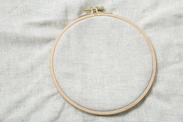 Wooden embroidery hoop with canvas as background