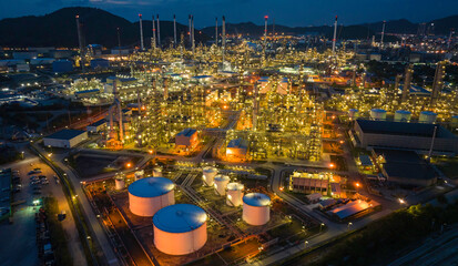 Fototapeta premium Oil refinery plant from industry zone, Aerial view tank oil and gas petrochemical industrial, Refinery factory oil storage tank