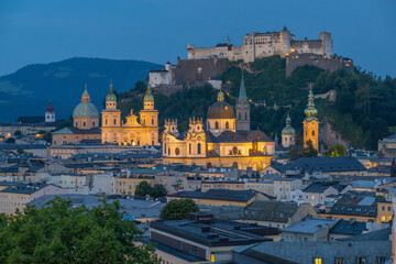 Fototapeta premium The City of Salzburg with the Fortress Hohensalzburg and the River Salzach from the Humbold Terrace in Austria