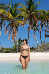 Beautiful girl posing on paradise beach