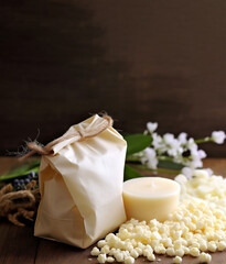 Fototapeta na wymiar Natural eco soy wax candles with mock up paper bag. Ingredient for homemade candles. Ai generated