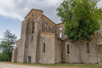 Fototapeta na wymiar San Galgano abbey in Chiusdino, Siena, Tuscany, Italy. Roofless nave with colonnade of the medieval Gothic style church