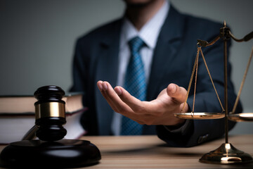 Lawyer's hand concept Justice  with Judge gavel, Businessman in suit or Hiring lawyers in the...