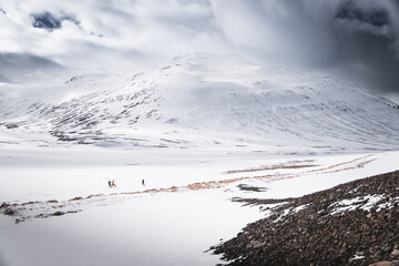 people on snow covered mountains, iceland