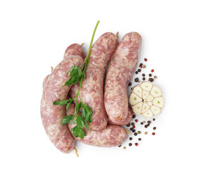 Raw fresh sausages, parsley, garlic and peppercorn on white background