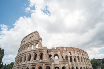Fototapeta na wymiar The Colosseum, an oval amphitheatre in the center of the city of Rome, Italy. It is the famous landmark built of concrete and sand.