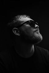 bearded man in sunglasses black and white portrait