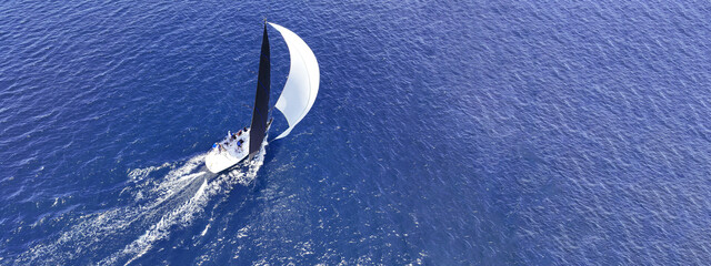Aerial drone ultra wide panoramic photo with copy space of beautiful sail boat with white sails...