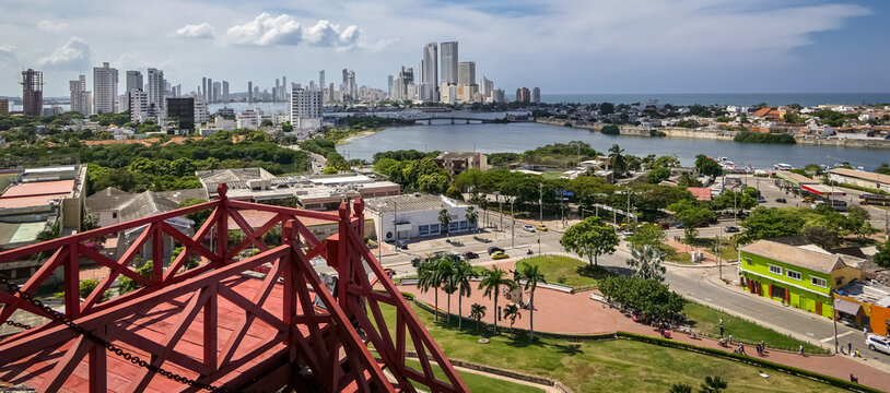 Panorama of new city Cartagena with sea on a sunny day from Castle San Felipe de Barajas, red wooden viewing platform in foreground, Colombia
