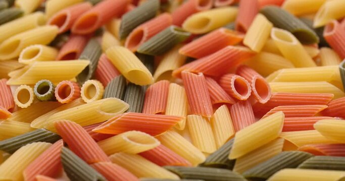 pasta backgroud - macro view of Dry Authentic Italian colorful penne